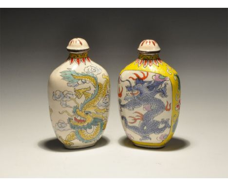 20th century AD. A mixed pair of white-glazed ceramic bottles, each with a polychrome dragon to each broad face, signature to