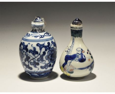 20th century AD. A pair of white-glazed ceramic perfume bottles comprising: one barrel-shaped with bands of blue floral ornam
