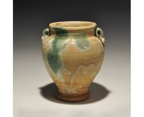 An undated archaistic white-glazed ceramic jar with narrow pedestal base and broad neck, rolled rim, two lateral loop handles