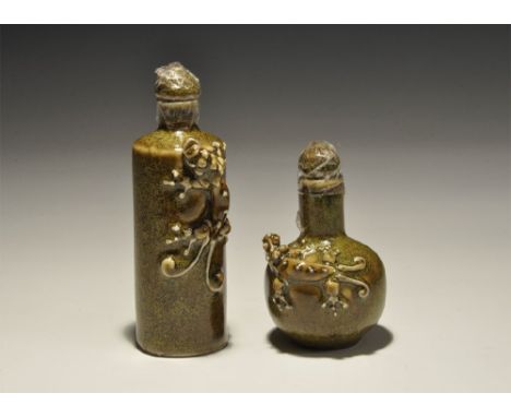 20th century AD. A pair of green-glazed ceramic perfume bottles, one squat and the other tall, each with an applied lizard fi
