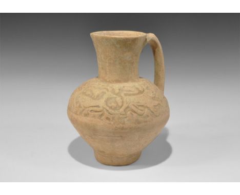 An undated archaistic vessel in 12th-14th century AD style comprising a bulbous jug with funicular neck and strap handle to t