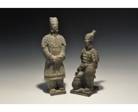 20th century AD. A pair of ceramic armoured warrior figures comprising: one standing with hands folded to his midriff; one kn