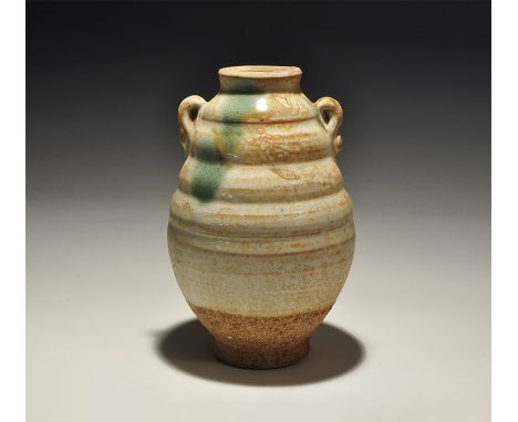 An undated archaistic white-glazed ceramic jar with biconical body, rolled rim, loop handles to the shoulders, green and ochr