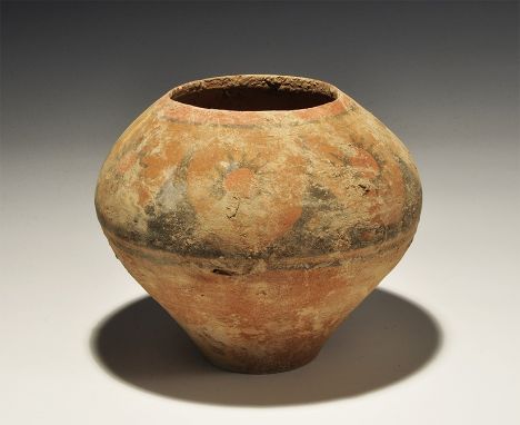 An undated archaistic terracotta piriform jar with a band of painted floral panels to the shoulder, ring to the neck. 481 gra