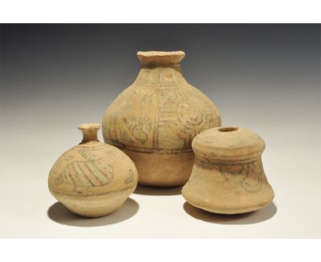 3300-1700 BC. A mixed group of terracotta items comprising: a globular jar with narrow neck and flared rim, panels of geometr