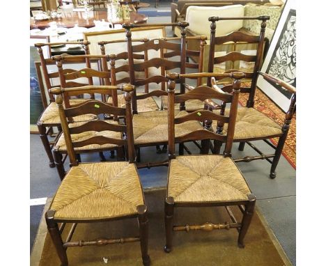 A set of eight early 20th century Lancashire country ladder back chairs, with turned crest rail, the two carvers with out-swe