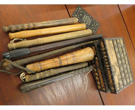 A selection of wooden truncheons, an African tribal stick and a porcupine quill box