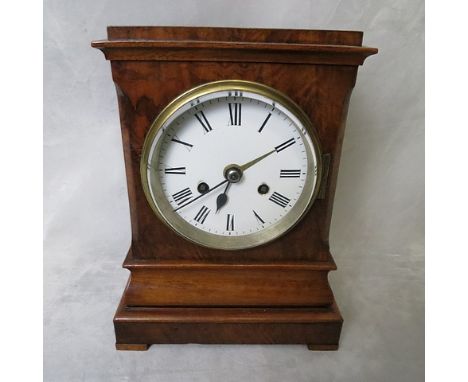 A 19th century walnut bracket clock having a white enamel dial, eight day movement, glass windows, Thomas and Profaze, London