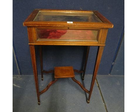 A late 19th century mahogany inlaid display table having inlaid banding, lower vase shelf on square legs