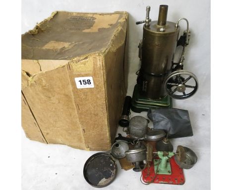 Circa 1910 a German tin plate Marklin steam engine model with accessories and instructions, in original box