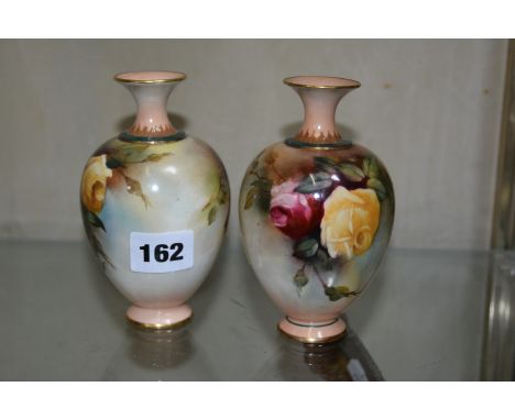 A pair of Royal Worcester Hadley's ware globular vases, painted with roses, puce printed marks, date code for 1907, 13cm high
