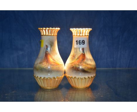 A pair of Royal Worcester pear shaped vases, painted with pheasants and signed by Jas. Stinton, shape no. 1061/G, date codes 