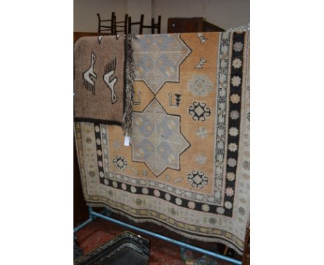 A machine woven carpet 162 x 246cm and another rug Best Bid