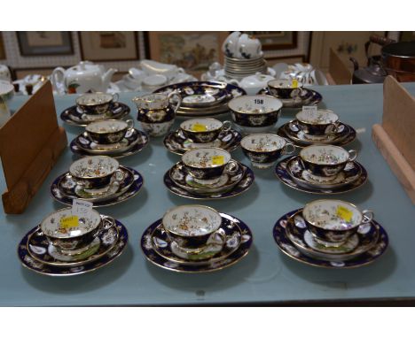 A Spode Copeland's china blue ground and gilt part tea service, printed and painted with exotic birds within flowering shrubs