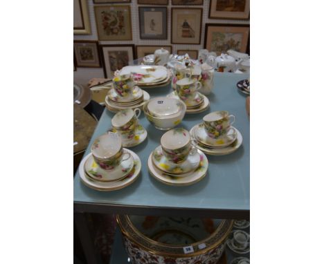 A Royal Worcester part tea service, painted with roses, one 9" lobed plate signed K. Blake and both two-handled serving dishe