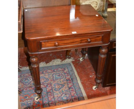 An early Victorian mahogany side table, with a frieze drawer on fluted legs with ceramic castors 72cm high, 69cm wide