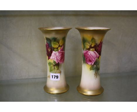 A pair of Royal Worcester trumpet vases painted with roses and signed by K. Blake and M.Hunt, 20cm high, shape G923, date cod