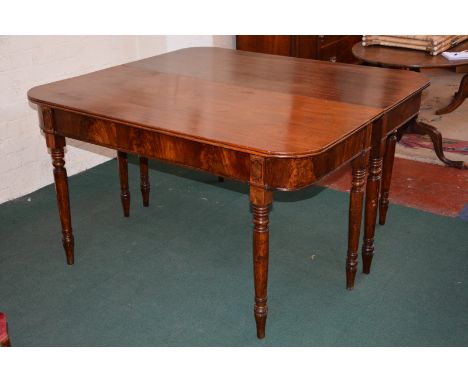 A pair of early 19th Century mahogany dining table ends on ring turned supports Best Bid