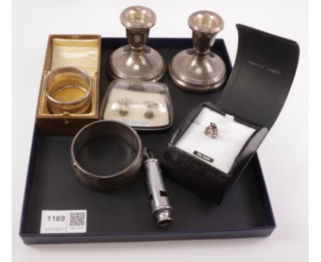 Pair of silver dwarf candlesticks, napkin ring and hinged bangle all hallmarked, pair cuff-links, police whistle etc   Condit