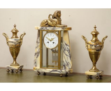 20th century French gilt metal and marble clock garniture, painted enamel dial, gilt sphinx figure, 'Exacta' barrel movement,