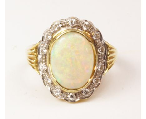 Australian opal and diamond cluster ring stamped 18ct (opal approx 2.25 carat)   Condition Report   Click here for further im