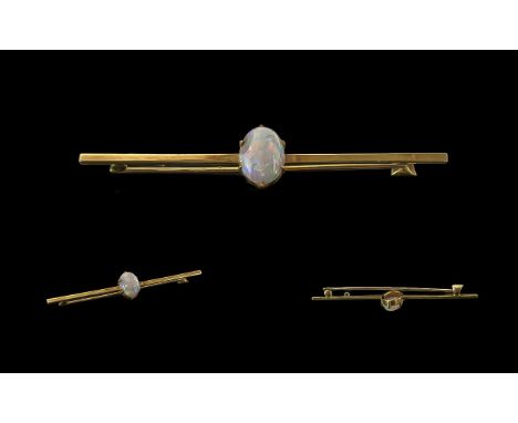 A Fine Victorian Period 15ct Gold Opal Set Stick Brooch. Marked 15ct. The Central Oval Shaped Opal of Pleasing Colours - Oran