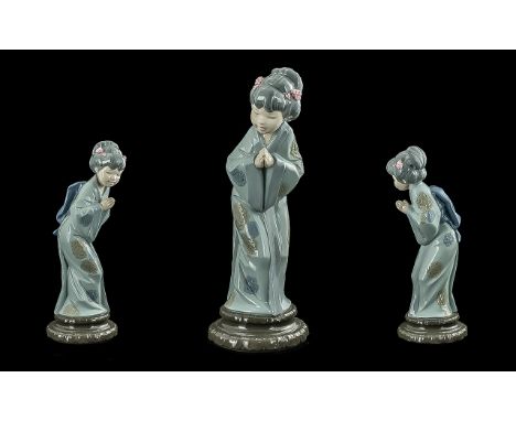 Five Lladro and Nao by Lladro Figures comprising 1/Lladro Hand Painted Porcelain Figure ' Japanese Sayonara ' Model Number 49