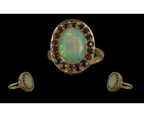 Antique Period - Attractive 18ct Gold Opal and Garnet Set Ring. Marked 18ct to Shank. The Central Opal of Good Colours, Est S