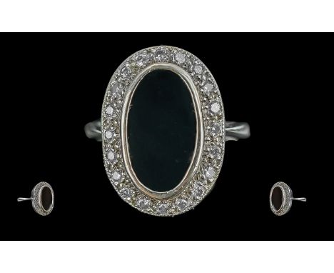 Ladies Platinum Diamond And Black Agate Set Cluster Ring - Not Marked Tests Platinum. The Central Oval Shaped Black Agate Sur