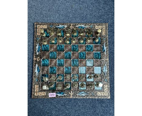 Colourful Enamel Chess Board, decorated with dolphins to the edges, and coloured checkers.  Metal chess pieces in the form of