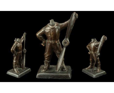 A Table Lighter in the Form of a Spitfire Pilot with a Propeller. Measures 11 inches in height.