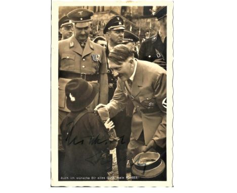 Adolf Hitler signed 6 x 4 b/w Hoffman portrait photo. Meeting a little girl with other Top officers. Signed to darker portion