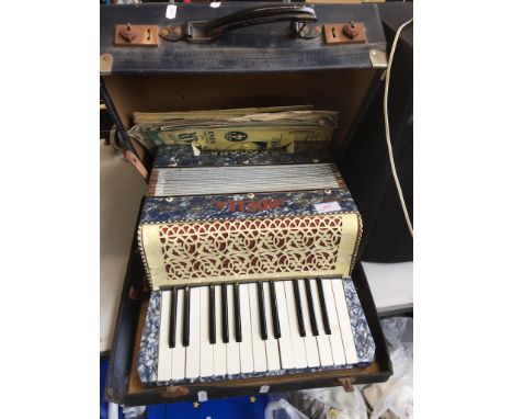 A MIDELLA CASED PIANO ACCORDION