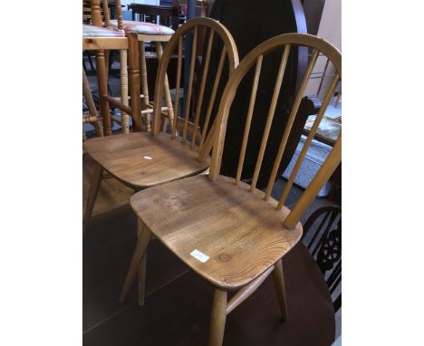 A PAIR OF ERCOL LIGHT ELM AND BEECH SPINDLE CHAIRS