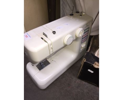 NEWHOME ELECTRIC SEWING MACHINE AND A BROTHER TYPEWRITER   T1