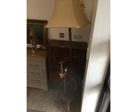 A TURNED BEECH LAMP STANDARD WITH SPINNING WHEEL BASE
