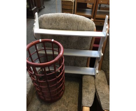 A WHITE PAINTED THREE TIER SHELF AND CANE STICK STAND