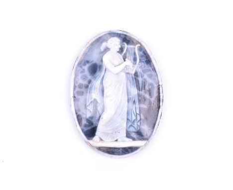 A 19th century blue agate cameo, of oval form, depicting a Classical maiden wearing flowing robes and playing a lyre, with sl