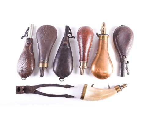 Four leather shot flasks, late 19th century, two stamped for Bishop, Bond St; W. Bartram, a cow horn shot measure, a brass &a