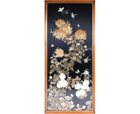 A large Japanese silk work, 20th century, embroidered with birds and butterflies amongst blossoming chrysanthemums, against a