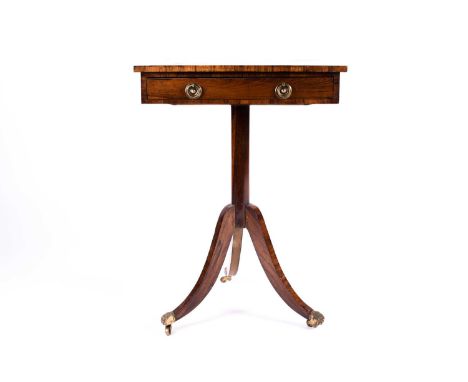 An early 19th century rosewood and brass inlaid side table, the top with inlaid brass florets and stringing, above a drawer w