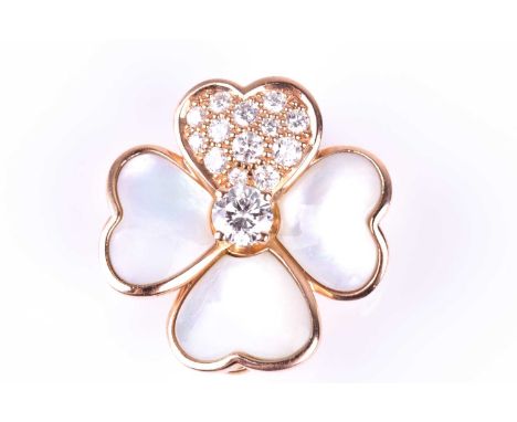 A Van Cleef and Arpels Cosmos clip pendant; designed as four heart-shaped petals, three set with mother-of pearl, the fourth 