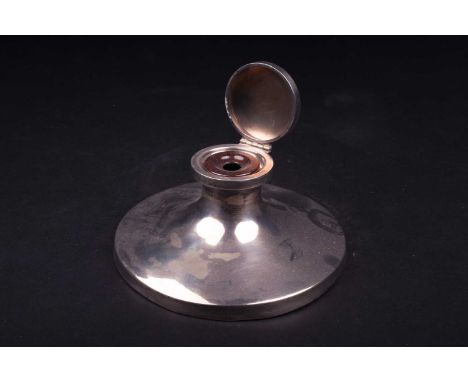 A George V silver capstan inkwell, Birmingham 1929 by Sanders &amp; Mackenzie, of plain, wide circular form, (filled), 16.5 c