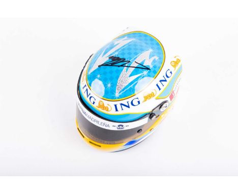 A signed Fernando Alonso F1 miniature helmet, (2008 season), the signature in black marker across the top, 12 cm high x 16 cm