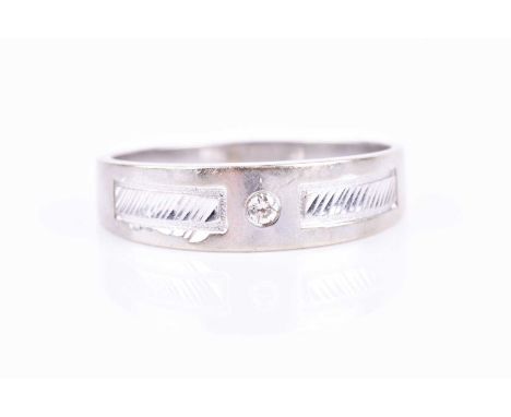 A white metal and diamond gents ring, centred with a round-cut diamond accent, with two engraved decorative bars to the shank