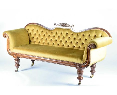 An early Victorian scroll end sofa, circa 1840, with mahogany show frame, upholstered in mustard yellow chenille style materi