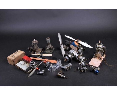A collection of thirteen model airplane internal combustion engines, to include Frog, Bee, A-M, Fox, D.C.Ltd, PET, Max-s, and