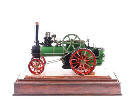 A fine quality scratch built scale model of a coal powered traction engine, in a wood and glass presentation case, with movin