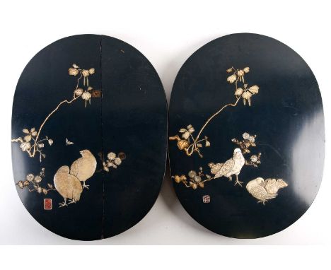 A pair of Japanese lacquered and inlaid oval panels, Meiji period, decorated with Quails, Pigeons and blossoming flowers in i