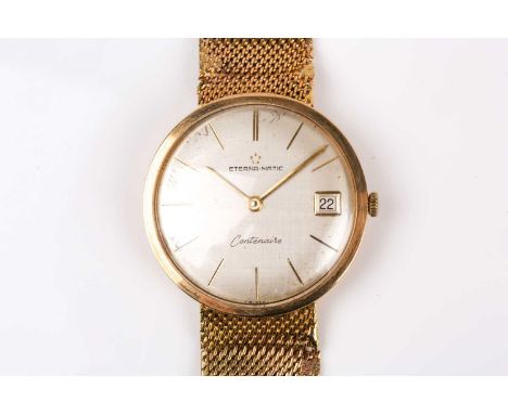 An Eterna-matic Centenaire 9ct yellow gold wristwatch, the silvered dial with slim baton indices and date aperture, in a 9ct 